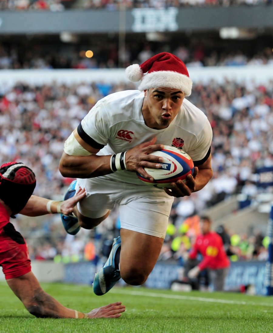 Luther Burrell in a Santa hat scoring for England